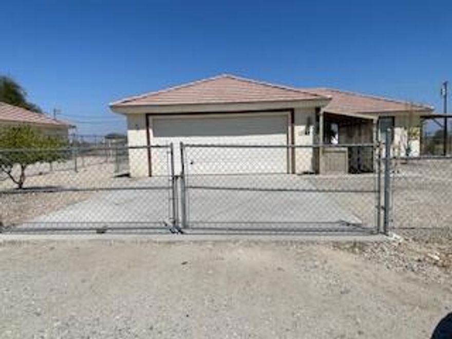 Home in Salton City, 3 bedroom 2 bath with large yard.  A playground is setup ready for the young ones.  2 car garage. Trees on property are on irrigation system.  Entire yard is fenced.  Please call office should you have any questions.  We will be happy to show you the property with an appointment.  Closing cost will be considered.