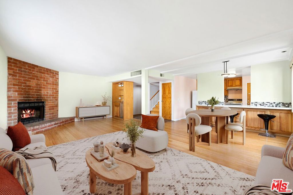 Welcome home to this cozy two story townhome steps to the Venice Canals and Abbot Kinney. Enter into a warm living room with bamboo floors which melds with an open kitchen and dining space. With an Eastern exposure and windows all around, there is an abundance of natural light with peace and tranquility. Upstairs boasts a primary bedroom with East facing balcony for peace and quiet, and a bathroom with dual vanity and travertine tiled shower. On the same level is an additional guest bedroom with en suite bathroom. Up above is a roof deck perfect for sunset cocktails or soaking up morning sunshine. Additional amenities include an entry level powder room, side by side laundry, and two tandem parking spots with additional guest parking. See this before it is gone.