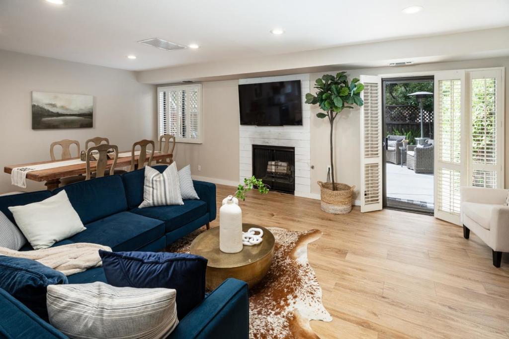 One of the finest townhome communities in MV! Don't miss this opportunity to own in the heart of Downtown Mountain View! This former model 3 bedroom 2.5 bathroom stunning unit has been beautifully updated with a remodeled kitchen and bathrooms, new tile flooring, all-new landscaping, and the convenience of upstairs laundry. The inviting layout features an eat-in kitchen with views of the beautiful common grounds, a spacious living room with a charming fireplace and direct access to a private backyard retreat. Upstairs, the primary suite boasts soaring cathedral ceilings, a walk-in closet plus an additional double-wide closet. Vaulted ceilings throughout the upper level enhance the natural light and open feel. Additional highlights include a detached one-car garage, an assigned open parking space, and a warm community of neighbors that make this enclave one of my favorite townhome developments in MV! Located just three short blocks from vibrant Castro St, 1.5 blocks from the highly acclaimed Farmers Market and Caltrain, and a pleasant stroll to schools, parks, and Stevens Creek Trail! Easy access to major tech campuses and commuter routes!