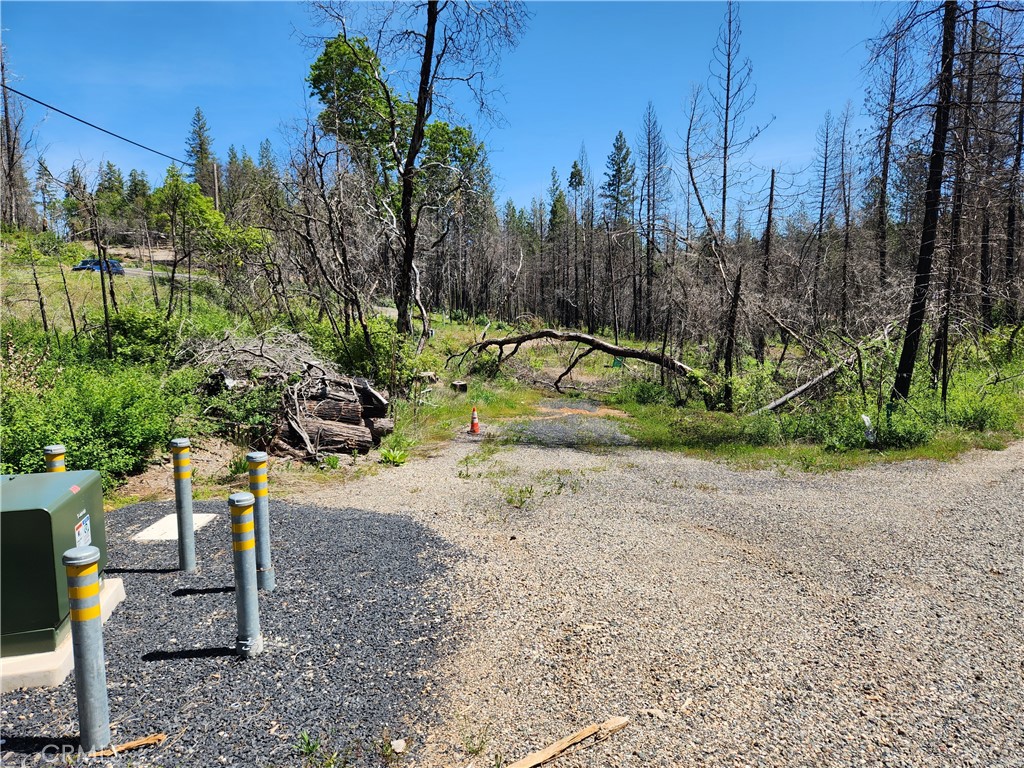 Your Country Lifestyle Awaits – Build Your Dream, Your Way! This 3.5-acre parcel offers a head start to your rural dream with an existing water well, 3-bedroom septic system, and propane tank. Enjoy the beauty of a seasonal creek and the endless fun of Lake Oroville just a short drive away. Escape the heat and fog at ~2000 ft elevation, with convenient paved access. Unlock the potential: create your unique countryside sanctuary on land already cleared after the Bear Fire, with vibrant new growth emerging. A new PGE underground box is installed in the graveled driveway. Reduced Price – Act Now! While seller financing isn't available, explore land and one-time close construction loans to leverage your savings. Invest in your peace and build the life you've always wanted!