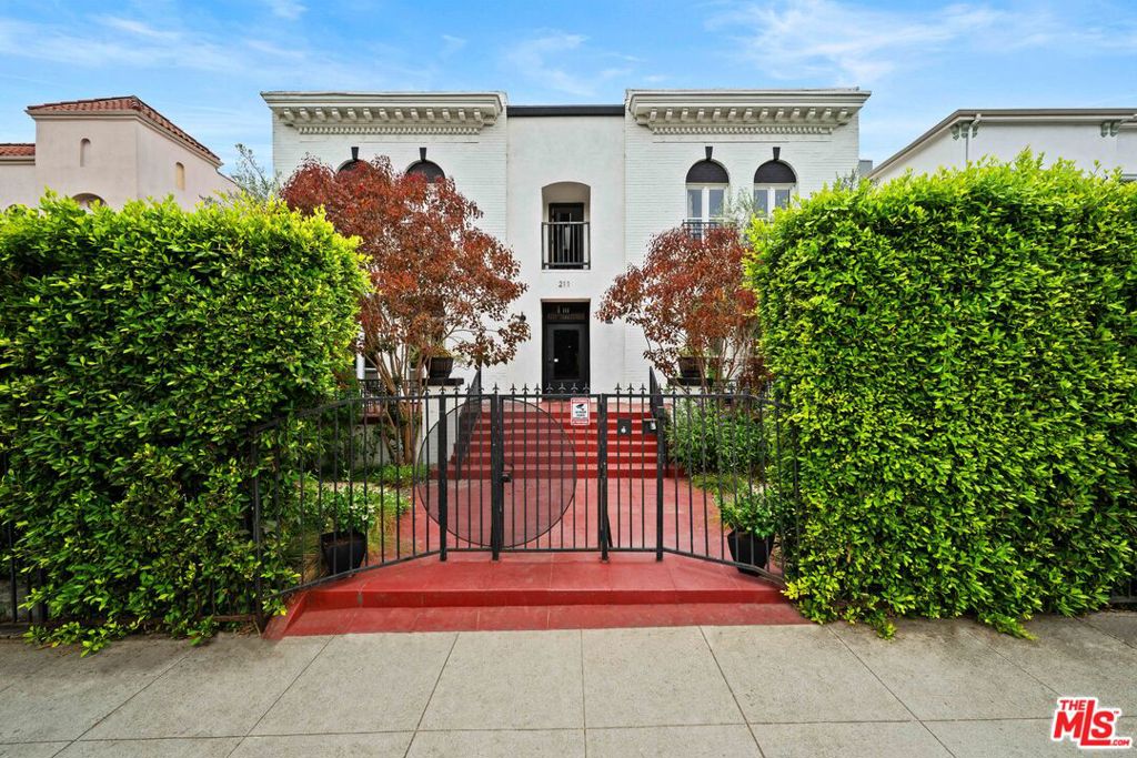 New Co-Ownership Opportunity: In the heart of Koreatown, 211 S Berendo St, Unit 3 is the kind of home where historic charm meets the ease of modern living. Past the front gate, a landscaped courtyard greets you with greenery and a sense of calm. Inside, this first-floor residence opens to generous living spaces wrapped in hardwood floors and framed by high, coved ceilings. Exposed brick adds texture and warmth, while sunlight pours in through tall windows. The kitchen was designed for both style and practicality, with open shelving, butcher block counters, and tile flooring. Everyday comforts are built in: in-unit laundry, your own parking space, and major building system updates completed in 2020. When it's time to unwind, head to the shared rooftop deck for panoramic city views or enjoy the peaceful courtyard below.