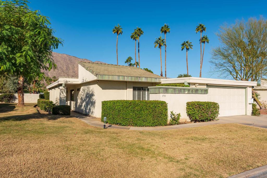 This is a lovely, light filled, FEE land home in the coveted Sunrise Villas.  Originally a 3 BR with atrium, the 3rd bedroom and atrium have been converted to make a large, light filled office/flex space.  The kitchen has been REMODELED BEAUTIFULLY with custom cabinetry, new counter tops and stainless appliances.   The living room has tall ceilings and generous west facing windows and sliders which bring in wonderful mountain views.  There is a large patio off the living room, adjacent to a large green space,  with an automatic awning.   The very generous primary bedroom has soaring ceilings, large closets and a refreshed ensuite bath.  The home also has a large guest room with plenty of closet space as well.  Rounding out the home is an interior laundry with direct access to a garage with one car parking.  Sunrise Villas has many beautiful neighborhood pools and spas as well as tennis/pickleball.  Association fees include cable and internet.   All of this is wrapped up in a very convenient South PS location.  Buyers and their agents do conduct their due diligence and verify all information about the property.