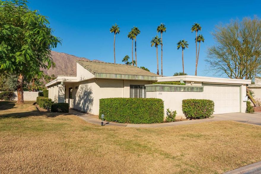 This is a lovely, light filled, FEE land home in the coveted Sunrise Villas.  Originally a 3 BR with atrium, the 3rd bedroom and atrium have been converted to make a large, light filled office/flex space.  The kitchen has been REMODELED BEAUTIFULLY with custom cabinetry, new counter tops and stainless appliances.   The living room has tall ceilings and generous west facing windows and sliders which bring in wonderful mountain views.  There is a large patio off the living room, adjacent to a large green space,  with an automatic awning.   The very generous primary bedroom has soaring ceilings, large closets and a refreshed ensuite bath.  The home also has a large guest room with plenty of closet space as well.  Rounding out the home is an interior laundry with direct access to a garage with one car parking.  Sunrise Villas has many beautiful neighborhood pools and spas as well as tennis/pickleball.  Association fees include cable and internet.   All of this is wrapped up in a very convenient South PS location.  Buyers and their agents do conduct their due diligence and verify all information about the property.