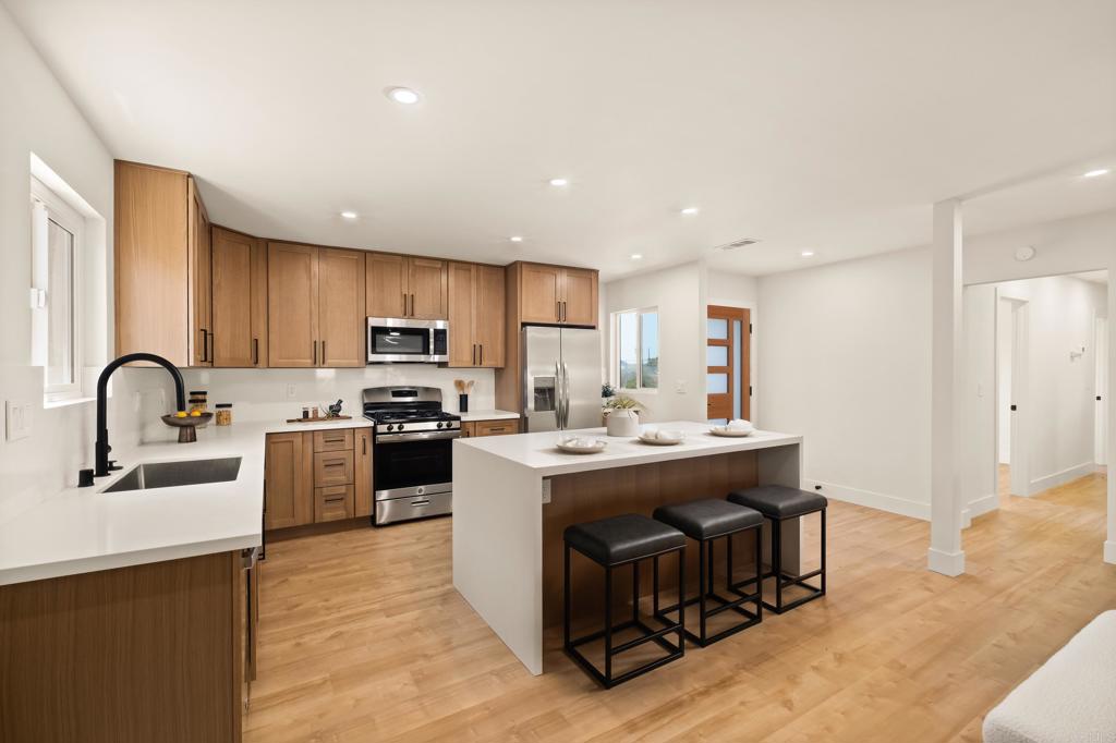 Located in the vibrant heart of San Diego, just minutes from local shops, parks, dining, and the nearby Navy base, this stunning, fully remodeled corner-lot home offers the perfect blend of style, comfort, and convenience. Featuring 3 bedrooms and 2 bathrooms, the open-concept layout is thoughtfully designed for modern living. At the center of the home, a designer kitchen showcases sleek finishes, custom cabinetry, and a striking waterfall island that serves as both a statement piece and a functional gathering space. Natural light fills the interiors, highlighting new flooring, contemporary fixtures, and refined details throughout. Enjoy a spacious primary suite, beautifully updated bathrooms, and a private outdoor area ideal for relaxing or entertaining. This move-in-ready gem delivers the best of San Diego living in a sought-after neighborhood.