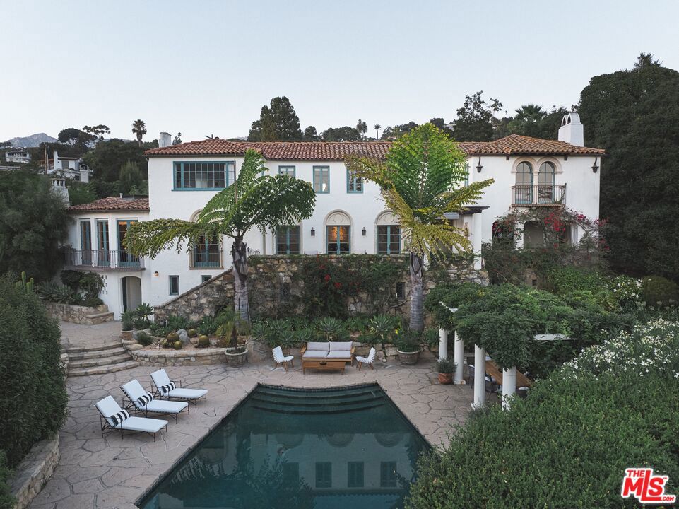 Quintessential Santa Barbara luxury and style merge with modern finishes and amenities at 1731 Lasuen Road on the famed American Riviera. Its impressive lineage and pedigree dates back to 1922, the year it was designed by Reginald Davis Johnson, one of Santa Barbara's most notable architects. Captivating views of the ocean, harbor and the city's red-tiled roofs accentuate the Spanish Colonial architecture. Light-filled and romantic in detail, this home tells the story of a bygone era and evokes emotion at every turn.Situated on a large 1.02 acre lot of usable land and located on one of the Riviera's most coveted streets, the home boasts 4 sizable bedrooms, an office/flex room, 5 1/2 bathrooms, and is updated throughout. The oversized primary suite contains 2 walk-in closets, luxurious bathroom, a fireplace and double french doors that look out to ocean and city views. The home is an entertainer's dream, equipped with multiple outdoor entertaining areas, a large pool, formal dining room, an open-concept modern kitchen and dreamy outdoor covered loggia. With mature and exotic landscaping reminiscent of Lotusland and dating back over a century, the outdoor setting is not easily imitable. Just a stone's throw away from the Belmond El Encanto Hotel and minutes from Downtown Santa Barbara and Montecito, this is truly a must-see-to-believe property.