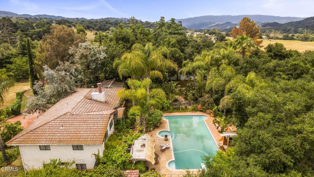 A Rare Water-Rights Sanctuary in Ojai Valley.In a world where water has become one of the most coveted resources on Earth, this extraordinary 2-acre estate in Ojai offers something increasingly rare: true water independence. At its core lies a powerful 165-foot well tapping directly into your own aquifer--a feature that puts this property in a league of its own. Described by the Seller as a lake below the property. As corporations and the ultra-wealthy quietly acquire land across California with riparian access, the value of water rights has soared. Here, you're not just buying land--you're securing your own source of life's most precious asset. While the 2560sqft, six-bedroom, three-bathroom main house is also conveniently connected to city water, forget escalating municipal water bills--the well provides abundant, private access. Properties like this one are becoming increasingly rare and valuable. Water rights are now considered a strategic asset, and this estate quietly embodies that truth. Add in fertile soil and ample space to grow crops or raise animals, and you've got the makings of a self-reliant lifestyle. It's more than a home. It's a hedge against scarcity, a statement of foresight, and a chance to live untethered. A fully permitted steel barn houses three separate unpermitted living quarters (one 3-beds & 1-bath and two 1-bed & 1-bath units, all three with kitchenettes), which has potential for multi-generational living, caretakers, or rental income. The property is bordered by two tranquil seasonal creeks and shaded by mature trees, the property is a private world unto itself. Whether you envision a peaceful retreat, an off-grid sanctuary, or a legacy estate for generations to come, this land adapts to your aspirations. Nestled in coveted Ojai Valley, this estate offers the options to modernize the existing structures or embrace the rustic charm as is. Either way, the land holds the promise of equity and opportunity. The future is flowing here--schedule your private showing and see why this property is not just desirable, it's essential. (Per Seller, the main house has six-bedrooms and the property encompasses two acres. Buyer to perform own due diligence)