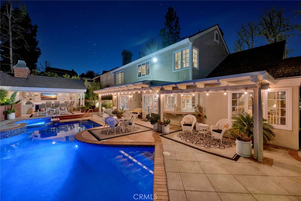 Nestled gracefully on a hillside, this stunning traditional-style home boasts remarkable curb appeal that immediately draws the eye. The exterior features extensive brickwork complemented by charming white shutters, while the beautifully landscaped grounds enhance its allure. From the front of the house, residents can enjoy breathtaking views of the surrounding mountains and hills, creating a picturesque backdrop. Inside, the home showcases exquisite woodwork and coffered ceilings that add a touch of elegance to the living spaces. The honey-colored wood flooring further enriches the warm and inviting atmosphere, making it a perfect retreat for relaxation and convenience. On the main level, a generously sized bedroom or versatile multi-use room features a coffered ceiling and a large bay window, providing ample natural light. Upstairs, the luxurious master suite offers a private retreat complete with a cozy fireplace, a spacious walk-in cedar-lined closet, and a lavish bathroom featuring a double vanity, spa tub, and an enclosed shower. The kitchen is both spacious and functional, equipped with modern appliances that are less than two years old. Outdoor entertaining around the gazebo and beautiful pool and spa becomes easy with plenty of entertaining area and an "outdoor kitchen" plus bar seating. Additionally, the HVAC systems have been recently updated in 2023 and 2024, ensuring comfort year-round. Completing this exceptional property is a three-car garage, providing ample space for vehicles and storage.