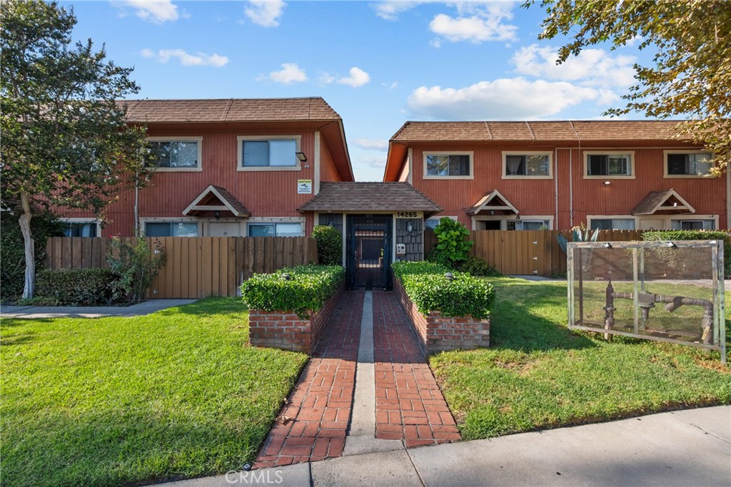 Discover this beautifully updated 3-bedroom, 2.5-bathroom townhome located in a secure, gated community in Panorama City. Offering comfort, style, and modern convenience, this move-in ready home is perfect for families, first-time buyers, or investors seeking a low-maintenance property in the San Fernando Valley. The inviting living room features a gas fireplace, ceramic tile floors, and abundant natural light that flows seamlessly into the dining area and kitchen. The kitchen is fully updated with new stainless steel appliances, marble countertops, and ample cabinet space—perfect for everyday cooking and entertaining. Sliding glass doors lead to a large front patio with a mature orange tree, creating a private outdoor retreat with enough space for a bistro set. A convenient half bathroom downstairs makes entertaining easy. Upstairs, enjoy newer laminate hardwood floors throughout, plus ceiling fans in every room for year-round comfort. The spacious primary suite includes its own private bathroom, while two additional bedrooms share a full bath. Fresh interior paint gives the entire home a modern and inviting feel. Additional highlights include central air and central heat, a front entrance security iron door, and a direct-access 2-car garage with new garage doors, upgraded motors with backup batteries, and washer/dryer hookups for maximum convenience. All of this is located in a well-maintained gated community with low monthly HOA fees, offering both peace of mind and affordability. With easy access to the 5, 405, and 118 freeways, plus close proximity to schools, parks, shopping, and dining, this property is a rare find in today’s market. Don’t miss your chance to own this updated Panorama City townhome—schedule your private showing today!