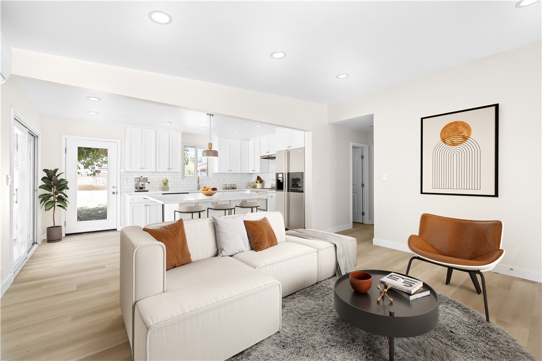 The bright, open-concept living room welcomes you in and flows effortlessly into a fully renovated kitchen. Picture yourself starting the day at the island with a hot cup of coffee or hosting friends while cooking your favorite meal. With modern finishes, and plenty of space to gather, this kitchen truly is the heart of the home. A sliding glass door invites you to step out onto a covered patio — the perfect spot to unwind after a long day or enjoy summer nights under the stars. Down the hallway, you’ll find two inviting bedrooms filled with natural light. The primary bedroom sits at the end of the hall and offers a generous closet and private access to the updated bathroom, which also opens to the hallway for added convenience. The bathroom features an LED mirror. Step outside and enjoy a backyard that’s inviting - complete with a covered patio for evening relaxation, a shed for extra storage, and easy access to a spacious two-car garage. Whether you're hosting weekend BBQs, starting a garden, or simply enjoying a quiet moment at the patio, this outdoor space is perfect for everyday living.
