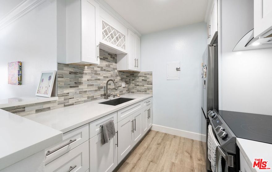 Enjoy resort style living in this one of a kind converted 2 bed 1 bath stunner at the beautiful Cross Creek Village Condo complex. No expense was spared to convert this one bedroom unit into TWO private Bedrooms. This spacious home offers a generously sized living room with exquisite wood floors throughout and updated lighting. Gorgeously renovated kitchen with elegant kitchen cabinets, stainless steel appliances, quarts counter tops, high quality backsplash and modern fixtures. Find your Zen in your very own Private outdoor balcony with all the bells and whistles for your quiet enjoyment. Last but not least, walk into to your tastefully remodeled bathroom with modern fixtures.  Enjoy flowing streams, beautifully landscaped grounds, new gym, 2 heated pools, spa, sauna, tennis courts, pickleball courts, basketball courts, a playground, secure parking, bike storage and minutes to beach. You also have a newly updated clubhouse with brand new kitchen, new furniture, pool tables, ping pong, 2 fire places and conference room. 10 min to LAX, Loyola Marymount University and local schools. Your search is over. Welcome home!!! Buyer and buyer's agent to satisfy all buyer investigations. Information deemed reliable, but not guaranteed. Buyer and buyer's agent to verify all information on MLS and other sources.