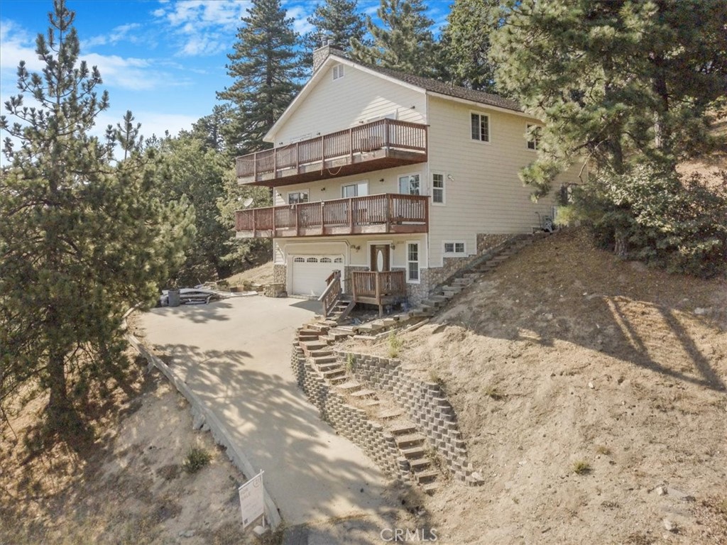 Welcome to your dream mountain retreat in Running Springs! Built in 2007, this beautifully maintained tri-level cabin offers breathtaking city light views by night and serene mountain charm by day. Featuring 4 spacious bedrooms and 3 bathrooms, this cabin blends rustic elegance with modern comfort.
Located just 5 minutes from Santa’s Village, 11 minutes from Snow Valley Ski Resort, and only 20 minutes from Lake Arrowhead, this home is perfectly situated for year-round adventure.
Step inside to find an open-concept layout, vaulted ceilings, and large windows that fill the space with natural light. Whether you’re relaxing by the fireplace, entertaining guests, or enjoying the view from the deck, this cabin is the perfect escape.
Don’t miss this rare opportunity to own a slice of the mountains with unbeatable location and views.