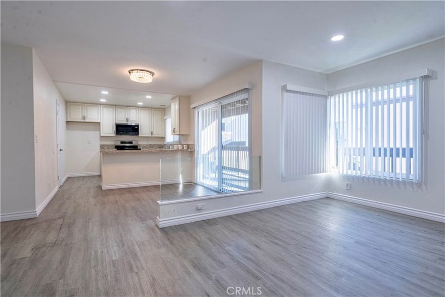 UNIT #1023 is an exceptional opportunity just 2 minutes from Disneyland, featuring an upgraded 2-bedroom, 2-bath condo with potential for short-term rental income, offering a stylish, move-in-ready home in a prime location with a private balcony, modern kitchen with pantry, microwave and stove included, new chandelier, new central AC, vinyl flooring throughout, upgraded closet shelving, a laundry area, two separate entrances, and a rare 2-car carport with EV charger (Space #21) in a gated community; seller/agent make no guarantees, and buyer to conduct their own investigation and verify all Airbnb and short-term rental requirements.