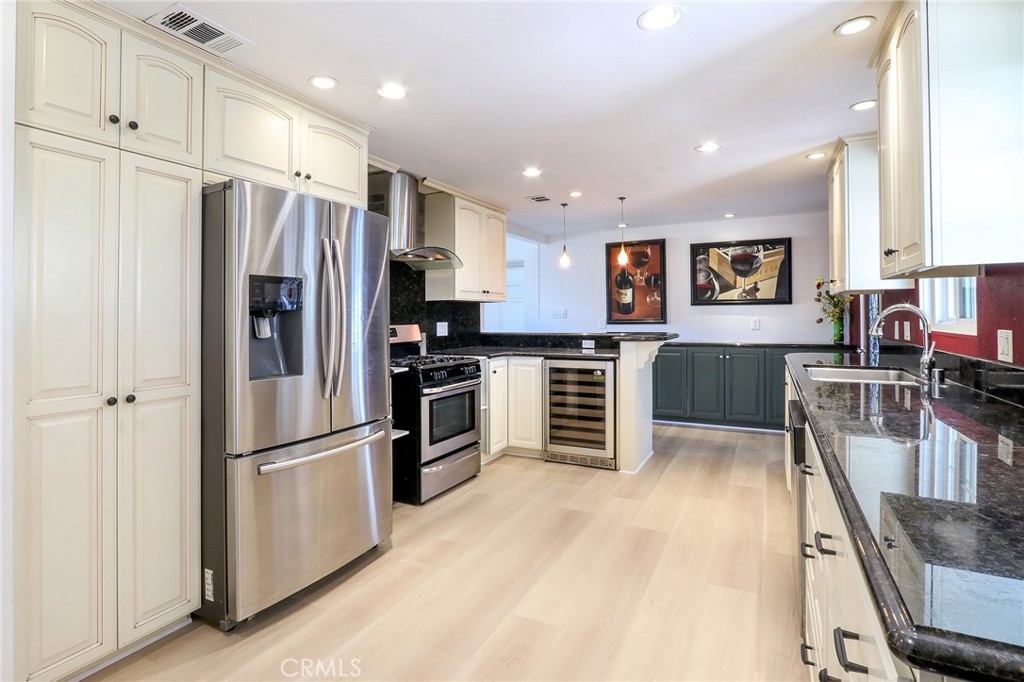 Beautifully upgraded turn-key home tucked away on a quiet cul-de-sac in North Ontario. This spacious property offers 1,497 sq. ft. of living space with 4 bedrooms, 2.5 bathrooms, and sits on an 8,400 sq. ft. lot. Additional highlights include a permitted Sunroom approx. 375 sq. ft. and a Detached Bonus flex space of approx. 400 sq. ft. at the rear of the property. The Chef’s kitchen boasts custom cabinetry with pull-out trays, abundant storage, expansive counters, a breakfast bar island, and large windows overlooking the covered patio and built-in BBQ area—perfect for entertaining. Upgrades throughout include fresh interior & exterior paint, double-pane custom windows, updated electrical, recessed lighting, central HVAC, copper plumbing, and luxury waterproof plank flooring. Abundant natural light throughout the home. The well-designed floor plan offers four bedrooms (two on each side of the home) and 2.5 bathrooms. The primary suite features a private half bath, two bedrooms share a remodeled bath with a walk-in shower, and a third full bath with a custom tiled shower/tub combination completes the layout. The bright and airy spacious Sunroom (approx 375 sq.ft.) creates a versatile space for dining, gatherings, or relaxation. Step outside to a low-maintenance backyard complete with a large covered patio, built-in BBQ with sink, spa-ready pad, mature avocado tree, privacy landscaping, and storage sheds. The detached Bonus room (approx. 400 sq.ft.) —with its own entrance, A/C, and electricity—offers endless flexibility as a home office, studio, gym, or entertainment space. Minutes from Upland, shopping, dining, parks, 10 freeways, and Ontario’s upcoming largest sports complex and entertainment district. Enjoy morning coffee or evening wine while taking in the panoramic mountain views year-round. The search is over... your Dream Home awaits!