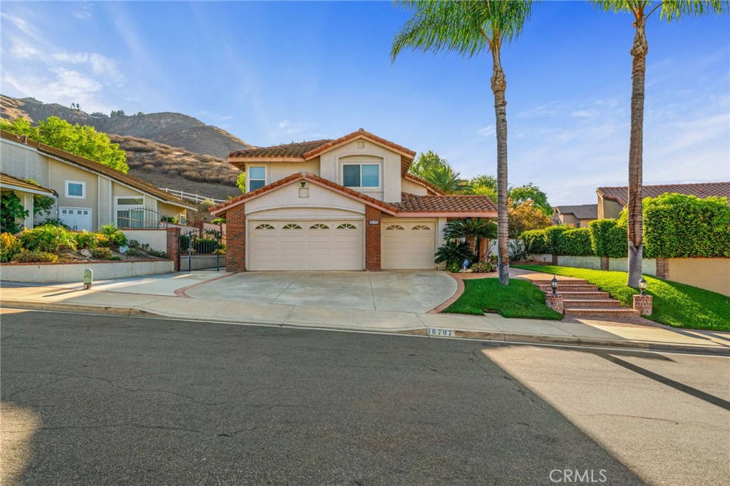 Tucked gracefully at the end of a tranquil cul-de-sac, this exceptional 4-bedroom, 3-bathroom residence blends timeless elegance with modern comfort. From the moment you arrive, the home’s impressive curb appeal and expansive 3-car garage with RV parking potential set the tone for the sophistication within. Step inside and be greeted by soaring cathedral ceilings, where natural light cascades through upgraded dual-pane vinyl windows, highlighting the home’s spacious, airy design. The formal living and dining areas exude charm and sophistication, creating the perfect setting for gatherings both intimate and grand. At the heart of the home lies a chef-inspired kitchen, beautifully appointed with stainless steel appliances, a spacious center island, and abundant cabinetry. Seamlessly open to the inviting family room, this space is tailor-made for both entertaining and everyday living. Walking upstairs notice the wide, open staircase overlooking the living room area. The luxurious primary suite is a serene sanctuary and offers additional space for an office or sitting sofa. The primary bedroom features a spa-like en-suite bath with a deep soaker tub, dual vanity, and a walk-in closet. Additional bedrooms offer comfort and versatility, ideal for family, guests, or a dedicated home office. These bedrooms also share an upgraded upstairs bathroom with walk-in shower. Outdoors, indulge in a backyard oasis designed for both relaxation and celebration. A custom, brick walkway leads you to a platform capturing breathtaking panoramic city views, while the Aluma-wood patio with recessed lighting and ceiling fans set the stage for unforgettable evenings under the stars. With thoughtful touches throughout, every detail of this residence has been carefully curated to deliver a lifestyle of elegance and ease. This remarkable home embodies the perfect harmony of luxury, comfort, and functionality—all while offering low taxes and an extraordinary opportunity to live in style.