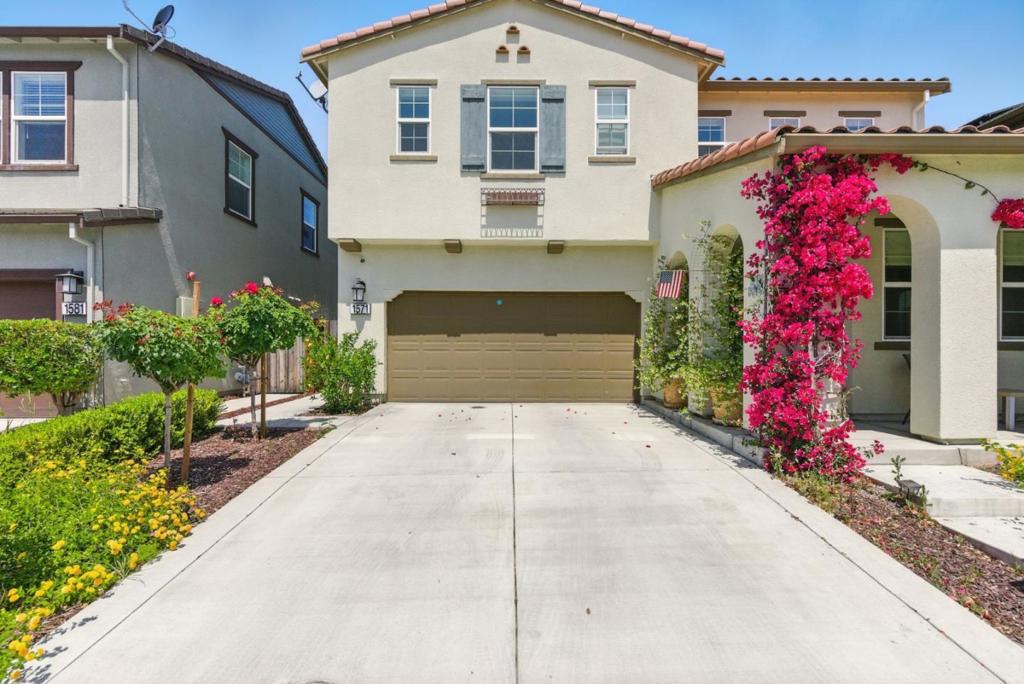 Meticulously maintained residence nestled within a prestigious gated community complete with dual gated entries and scenic oak-dotted hillsides. Surrounded by miles of serene walking paths. Discover 2,409 square feet of elegantly designed living space, enhanced by abundant natural light. The home features four spacious bedrooms, including a convenient downstairs bedroom and full bath ideal for guests. Each bedroom includes generously sized closets, providing ample storage throughout. The heart of the home is the stylish kitchen, appointed with stainless steel appliances, a large center island, and seamless flow into the dining and living areas perfect for entertaining. Upstairs, a versatile loft/lounge area offers endless possibilities: media room, office, playroom, or creative studio. Beautifully landscaped backyard, where you'll find a lush lawn, BBQ area, and a charming water fountain, creating the perfect outdoor retreat for relaxing or hosting. Built in 2019 by Lennar Homes, this energy-efficient residence comes equipped with solar panels. Ideally located near middle school, parks, shops, coffee spots, and restaurants. Homes in this sought-after development rarely become available don't miss your chance to experience this bright, beautifully maintained haven for yourself!