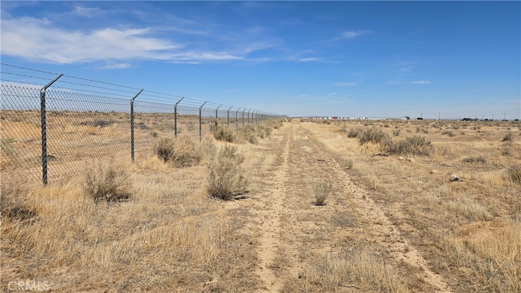 Unique, just over an acre parcel adjoining the Mojave Air & Space Port! Located on the north side of the Mojave-Barstow Hwy, CA-58 and currently zoned A-1 for Limited Agriculture, this parcel is Industrial-adjacent and appears to have great potential for rezoning. A convenient location nearby many aerospace companies and other businesses along a major transportation corridor - and an affordable opportunity! *Buyer to make their own independent investigations regarding Zoning & General Plan Designations, Environmental & Hazard Zones, Access & Development Costs, Availability & Costs of Utilities.
