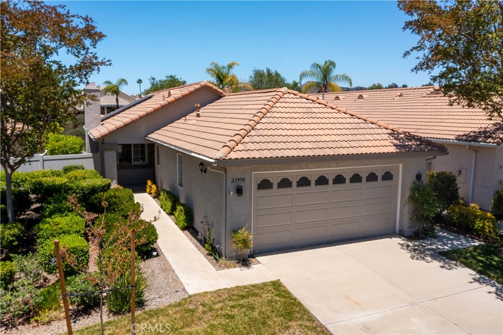 Welcome to 23998 Via Astuto, an impeccably maintained and beautifully upgraded home nestled in The Colony, one of Murrieta’s most desirable 55+ gated communities. This open-concept floorplan is both elegant and functional, offering a seamless flow between living, dining, and kitchen spaces — perfect for entertaining or simply enjoying your everyday comforts.
Inside, you'll find thoughtful upgrades throughout, including elegant laminate flooring in a warm cherry-honey hue which lends a refined, timeless aesthetic while offering low-maintenance comfort. Tailored plantation shutters throughout the home offer a clean, cohesive look with adjustable louvers for ideal light and privacy, and a PAID OFF solar system, delivers energy efficiency and peace of mind. The well-designed layout offers spacious bedrooms, a versatile den or bonus space, and a bright kitchen that opens to the living area, all flooded with natural light.
Step outside to your own private backyard retreat, complete with lush landscaping and a covered patio — the perfect setting for morning coffee, evening wine, or quiet reflection. Whether you're hosting guests, enjoying a quiet conversation, or basking in a peaceful moment alone, this outdoor space is designed for comfort and serenity. This home isn't just about stylish interiors — it's about elevated living in a community where every day feels like a resort getaway.
The Colony offers resort-style amenities including a clubhouse, year-round pool and spa, tennis and pickleball courts, fitness center, walking trails, and a beautifully maintained golf course — all with 24/7 guarded gate security.
Whether you’re looking to downsize without compromise or step into an active adult lifestyle, this is the home, community, and lifestyle you’ve been waiting for. Don’t miss your chance to tour this stunning home and experience The Colony for yourself — schedule your private showing today!