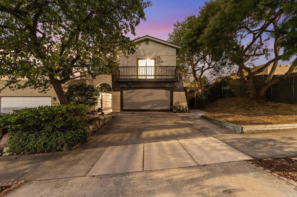 This beautifully updated home in Oceanside offers stunning views of the surrounding mountains, hills, and canyon. Nestled in the foothills, it is a single-family residence with only one shared wall, providing a sense of privacy and space. Inside, the home has been thoughtfully upgraded with durable vinyl plank wood flooring, a remodeled kitchen featuring quartz countertops, a designer tile backsplash, and stainless steel appliances. The bathrooms have been refreshed with stylish designer tile and modern finishes. The floor plan is designed for flexibility, with dual primary suites located on separate levels. The upstairs suite boasts an expansive walk-in closet, dual sinks in the bathroom, and access to a large sunken loft with a private balcony that showcases sweeping hillside and mountain views. Downstairs, both bedrooms feature mirrored closet doors and easy access to the second remodeled bathroom. One of the bedrooms can also serve as a comfortable home office or creative studio. From the kitchen and dining area, step out to a newly landscaped side patio framed by an arched trellis, leading to the spacious backyard. Tall shade trees create a peaceful and private retreat, perfect for relaxing or entertaining. The location is ideal, offering quick access to downtown Oceanside, major freeways, neighboring towns, the beach, and an abundance of local amenities and attractions. This home blends modern upgrades with a warm, inviting layout, making it an exceptional opportunity in one of Oceanside’s most desirable areas.