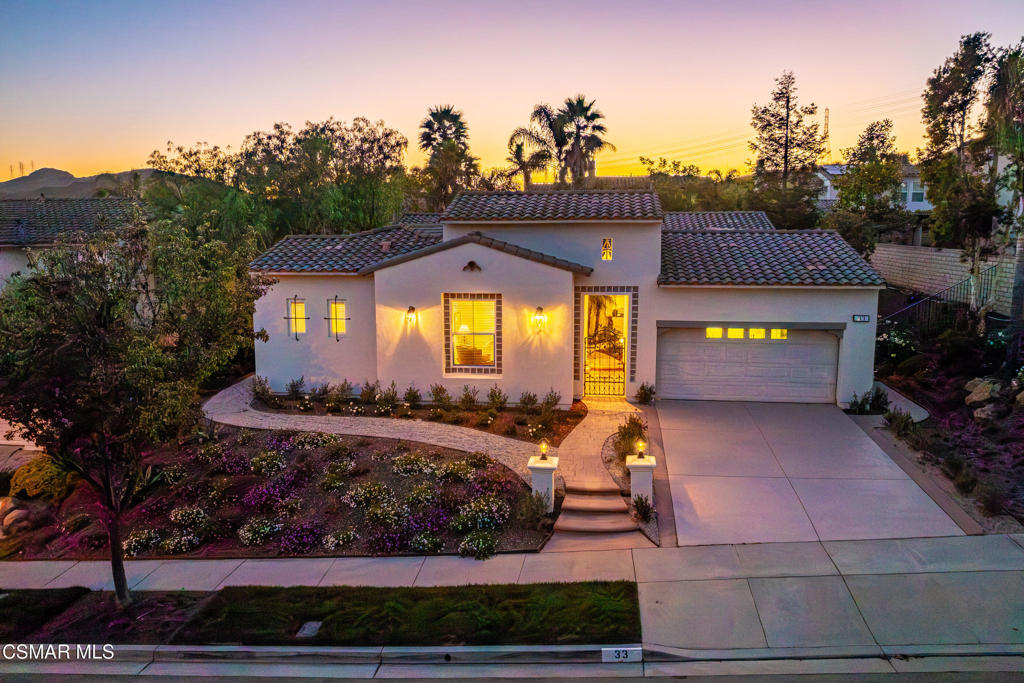 Step into one of Dos Vientos' rare finds: a freshly updated, move-in ready single-story home that blends modern comforts with timeless style. From the moment you approach, a striking iron gate and an elegant Santa Barbara-style bell welcome you with old-world charm and a sense of lasting permanence. Crisp new paint, stylish flooring, and updated landscaping featuring olive bushes, easy-care pea gravel, and neat outdoor spaces mean your to-do list is blissfully short--just move in and relax. The home's inviting entry welcomes you to spaces filled with soaring ceilings, natural light, graceful archways and dreamy neutral tones. At its heart, a serene European-inspired courtyard ushers sunlight throughout and creates a seamless flow between indoor and outdoor living. Both the kitchen and office spaces open directly to the courtyard, making every day feel like a retreat. Cooking and entertaining are easy in this kitchen, featuring a large island, breakfast bar, and generous gathering space. The adjoining family room--with its cozy fireplace and recessed lighting--makes it easy to host or simply unwind. A separate, sunny living room provides the perfect backdrop for gatherings, big or small. The versatile floor plan ensures privacy for everyone. With the primary suite thoughtfully separated from the other bedrooms, enjoy the spa-like bath, dual sinks, walk-in shower, soaking tub, and two generous closets--a true sanctuary. An additional en-suite is perfect for guests or multi-generational living, while the dedicated fourth bedroom opens to the courtyard and currently serves as a home office--ideal for working in style. This newer home, built in 2003, spans 4 bedrooms, 3.5 baths, and 2,878 sqft on a single level. Located just minutes from top-rated schools and near Dos Vientos Community Park, and picturesque hiking trails, this property truly stands out. Don't wait on this one!
