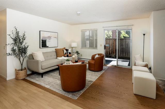 Three bedroom, two bath condo, offering a spacious living room with laminate flooring, wood burning fireplace and sliding door out to the fenced back patio, great for relaxing and entertaining. Updated kitchen with painted cabinets, granite countertops, newer appliances, lighting, panty & breakfast bar. Dining off the kitchen with recessed lighting and large widow. Primary suite with large closet and ensuite bathroom featuring a single vanity with stone countertop & stall shower with tile surround. Two additional bedrooms and guest bathroom with single vanity, stone countertop and tub/shower. Inside laundry with washer & dryer. One-car carport with storage closet and one additional uncovered parking. The community offers a pool and nice greenery. Right across the street from Weekes Community Park where you can enjoy tennis, playground, BBQ and more! Close to shopping and restaurants. Easy access to freeways for commuting. This is a Short Sale and requires Lender Approval.
