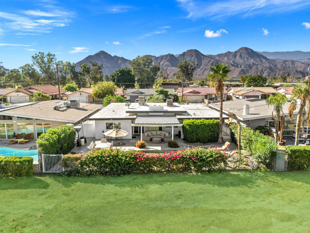 Mid-Century Modern Golf Course Home with Pool | Renovated & Move-In ReadyWelcome to this stunning mid-century modern retreat -- a beautifully updated three-bedroom, two-bathroom home located right on the golf course with very low HOA fees (only $30/month)! Every detail has been thoughtfully upgraded to blend timeless design with modern luxury.Step inside to discover a freshly painted interior with smooth, five-level wall finishes and all-new dual-pane windows and sliding doors that fill the home with natural light. The brand-new kitchen features custom cabinetry, elegant quartz countertops, and a full suite of new stainless-steel Bosch appliances, including an infrared European Verona range.Enjoy year-round comfort with two new A/C systems and smart thermostats for energy-efficient climate control. The bedrooms feature plush new carpeting, while the rest of the home is enhanced with LED lighting throughout for a clean, modern finish.Additional Upgrades Include:Completely repainted interior and exteriorNew foam-coated roof and re-roofed pergola structuresNewly added laundry room in the garage, fully wired and insulatedFreshly painted fences and gatesRedone landscaping with a stylish fan pergola and outdoor fireplace, perfect for entertainingThis property offers the ultimate desert lifestyle -- a private pool, golf course views, and mid-century modern charm combined with all the conveniences of a brand-new home.Don't miss your chance to own this beauty!