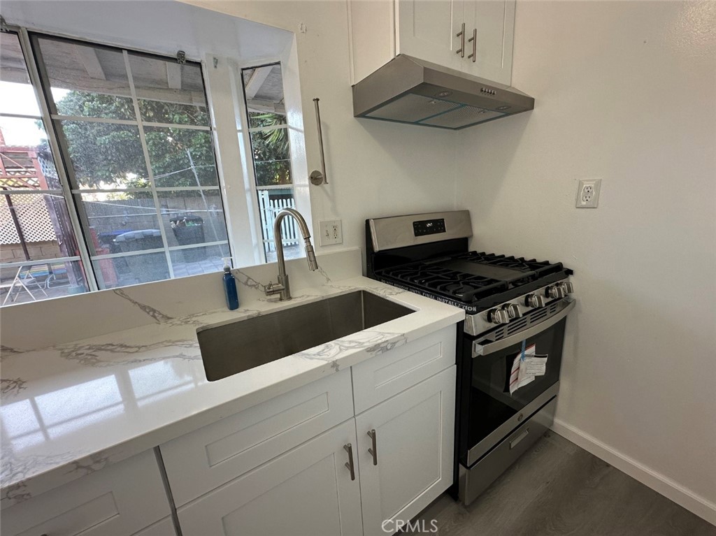 This beautifully renovated junior unit is attached to the main house but features its own private entrance, offering both convenience and privacy. Situated in a quiet, desirable neighborhood of Garden Grove, the entire space has been thoughtfully updated with modern finishes, creating a clean and inviting atmosphere throughout. The unit offers two well-sized bedrooms, each with generous closet space for ample storage. The updated bathroom includes a full-sized bathtub—ideal for both quick showers and relaxing soaks. The kitchen is a true highlight, showcasing elegant quartz countertops, sleek white cabinetry with abundant storage, a stainless steel gas stove, a deep stainless steel sink, and a modern pull-down faucet—perfect for daily cooking and entertaining. A cozy living area completes the layout, offering a comfortable spot to relax or set up a home office. Nearly every element of the unit has been remodeled, including flooring, fixtures, and appliances, making it completely move-in ready with no updates needed. Best of all, electricity, gas, and water are included in the rent, helping simplify your monthly expenses. The property also features a long driveway for convenient off-street parking, plus plenty of open street parking that’s always available.
This is a rare opportunity to live in a stylishly upgraded, move-in-ready unit in one of Garden Grove’s most convenient and welcoming neighborhoods. Don’t miss out!