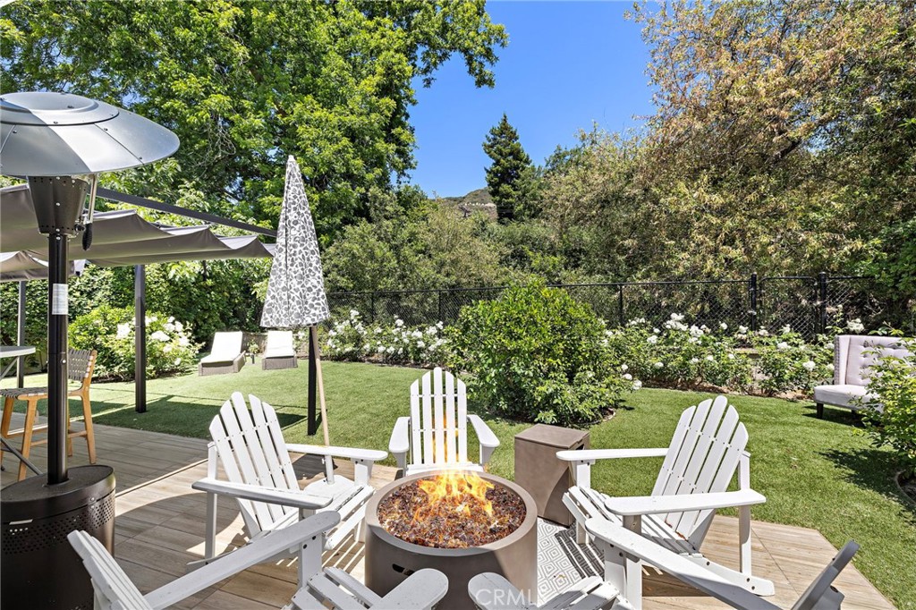 Nestled directly across from over 30,000 acres of Laguna Canyon’s Wilderness Park, this beautifully updated single-level home blends privacy with convenience in one of Laguna Beach’s most serene settings. Featuring 3 bedrooms and 2 bathrooms across 1,192 square feet, the home is light-filled, updated, and ready for its next chapter.
Inside, the open-concept layout features stone flooring, remote-operated skylights and window coverings, and a spacious living room anchored by the modern, beach-inspired fireplace. The upgraded kitchen is outfitted with built-in appliances, quality cabinetry, and sleek countertops—perfect for both everyday living and entertaining.
Step outside to your private outdoor space, ideal for weekend lounging, gardening, or catching golden hour through the canyon trees. With a 7,560 square foot lot, the property also includes a spacious attached garage and additional off-street parking.
Additional highlights include a large attic for storage, a private front courtyard for outdoor relaxation, and in-unit laundry/
Enjoy peaceful canyon views, access to top-rated Laguna Beach schools, and the best of coastal living—just minutes from town, trails, and the beach.