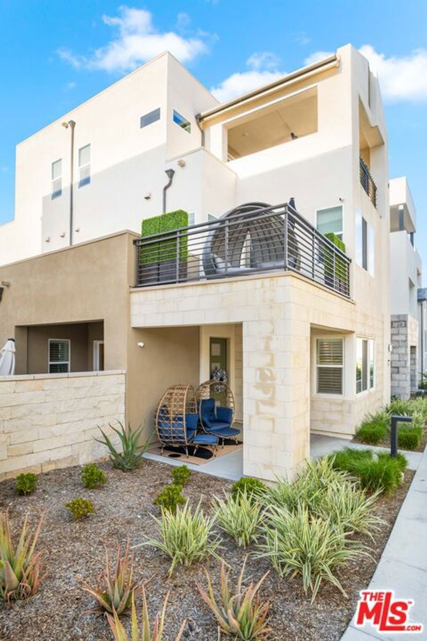 This stunning, Fully Furnished three-story home is the perfect blend of style and functionality, with great living space and plenty of entertainment areas for guests. The first floor boasts a modern gourmet kitchen with top-of-the-line appliances, custom cabinets, and quartz countertops, perfect for cooking up a storm while guests sit at the huge island. The entire home can be set up as a smart home . Can be set up to be controlled from your fingertips, making everything from the lighting to the temperature a breeze to manage. The first floor also features a bedroom with a full bathroom, an ideal in-law suite or guest room. Head up to the second level and you'll find the living quarters, including an oversized primary suite with its own private patio and stunning views. The large bathroom has dual sinks , a walk-in closet, and a stand-up tile shower. The entire level is equipped with smart lighting and fans for added convenience. The real showstopper, however, is the private living room on the third floor, complete with a full bar and an extended patio that offers views of the surrounding area. Enjoy sunsets and sunrises while sipping on your favorite wine from the built-in wine fridge. The space is perfect for entertaining guests or just relaxing with friends. The community itself is environmentally friendly, with multiple charging stations and a community garden that harvests every Tuesday in the summer. There are also three pools, playgrounds, paseos, and parks, making it the perfect combination for activities and frolic. Don't miss out on the opportunity to make this stunning home your own. The solar is paid off and the property has 2 AC units. This community is located in the up and coming Five Points area, it will not disappoint in design, location, or amenities.  Owner will consider short term at a premium.