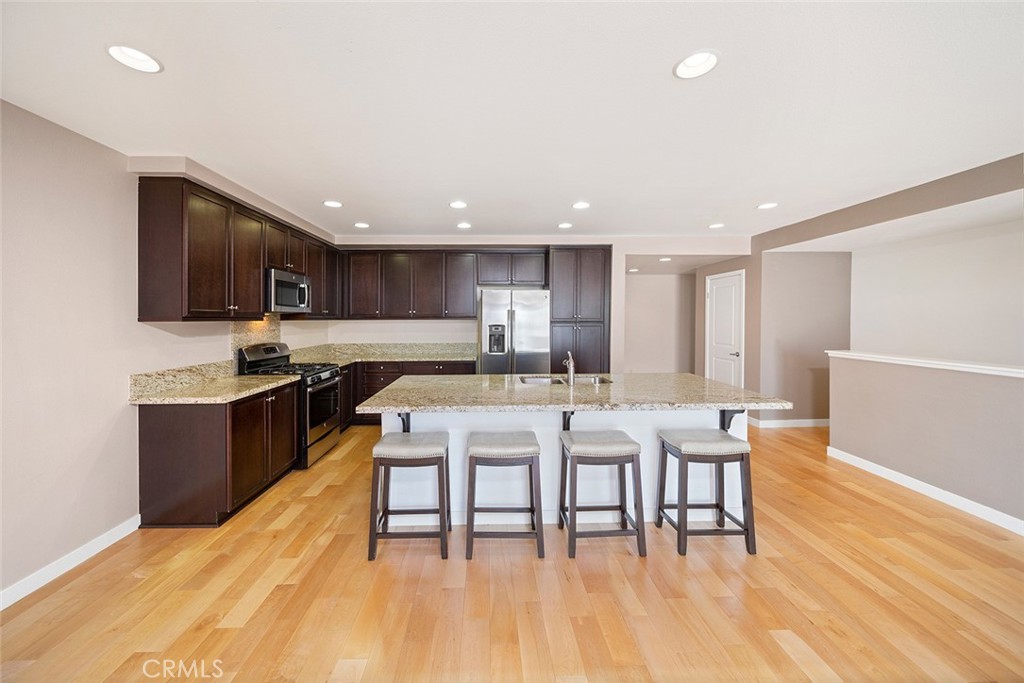 Situated in the premiere Irvine Financial District location, the ideal Madison community at Central Park West has innumerable amenities. Enter the perfectly upgraded contemporary urban townhome and discover an open and airy living space. Highlights of the home include expansive living room ceilings, recessed lighting, multitude of windows, beautiful flooring, large gourmet kitchen with granite countertops, and stainless-steel professional appliances. Featuring a desirable floor plan, this spacious and chic dual master, 2.5-bathroom home boasts 1,919 square feet of living space, additional downstairs den/office, and a private attached 2 car epoxy garage. The world class amenities at Central Park West include 2 resort-style saline pools and spas, 2 lush parks, pickleball court, state of the art health and fitness center, and 8,000 square foot clubhouse and recreation pavilion. Live, work, and play in what has become the hottest location in Orange County. Conveniently located near Fashion Island, South Coast Plaza, UCI, and John Wayne Airport.
