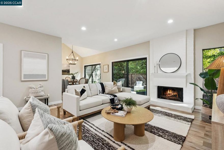 Tucked at the end of a quiet cul-de-sac in the Summit Ridge community, this light-filled townhome sits within the highly regarded Lafayette School District and offers a daily connection to nature and views. Step outside the front door and the neighborhood opens to a striking, dead-on view of Mount Diablo—an everyday reminder of where you live.  Inside, vaulted ceilings create an airy feel, complemented by newer luxury vinyl plank flooring and a crisp white kitchen with quartz countertops and updated appliances. Thoughtful improvements continue throughout with updated interior doors, fresh carpet, and paint. The expansive primary suite is a true retreat, featuring a fireplace and a generous ensuite bath with soaking tub, separate shower, and water closet.  An attached two-car garage with epoxy floors and built-in storage adds convenience, while community amenities include a pool, spa, and easy access to nearby hiking trails. Moments from BART, major freeways, and the shopping, dining, and cultural offerings of both Lafayette and Walnut Creek, this home blends comfort, scenery, and everyday ease. Step into a lifestyle shaped by views, trails, and calm.