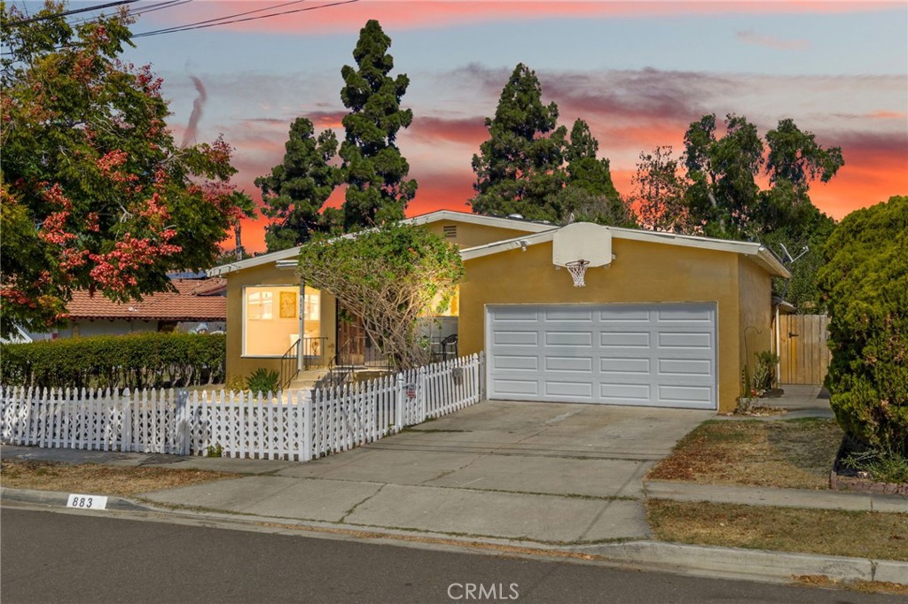 Welcome to this charming SINGLE-STORY home in Chula Vista just minutes from the ocean, filled with character & modern updates. A white picket fence greets you at the front along w/ a brand new garage door & plenty of curb appeal. As you make your way up the front steps, a quaint porch invites you to sit & enjoy your morning coffee or watch the kids play out front. Step inside & you'll notice the newly installed luxury vinyl plank flooring & freshly painted neutral walls that create a warm & inviting feel. Brand new interior doors have also been added throughout, giving the home a polished & cohesive look. The front living room features a large floor to ceiling window that fills the space w/ natural light & a ceiling fan overhead. The kitchen has been refreshed w/a brand new 5 burner gas cooktop & stainless steel dishwasher. A large window above the sink makes the space bright and airy, and the double ovens offer extra convenience for cooking & entertaining. Just off the kitchen is a separate dining area w/ a new light fixture overhead. Down the hallway you'll find 3 secondary bedrooms, along w/ a full bath featuring a tub and shower combo. The primary suite(bedroom 4) sits at the end of the hall and includes an attached bath w/ a new vanity & walk-in shower. From the kitchen, step down into a spacious great room that can easily become the heart of the home. With room for everyone to gather, this is the perfect spot for movie nights, game nights, or simply enjoying time together. A sliding door leads you directly out to the backyard where endless possibilities await! The expansive 8,600 square foot lot includes mature fruit trees such as dragon fruit and fig, 2 sheds, a separte fenced in play area with swing set & plenty of open space to create the yard of your dreams. There is also a playset & trampoline already in place & a newly installed fence for privacy and peace of mind. For those who love gardening, the soil here has a wonderful reputation for growing fruits & vegetables. Additional features include OWNED SOLAR PANELS that will help you save $$, a newer water heater, a newer furnace, and a 2-car garage w/ ample storage. This location is ideal with Cook Elementary less than 1/2 a mile away, convenient shopping & dining nearby, & easy access to both the 805 & 15 freeways. Residents can also enjoy the nearby Otay Ranch Town Center for shopping, dining, and entertainment, as well as Otay Valley Regional Park which offers trails for hiking and biking.