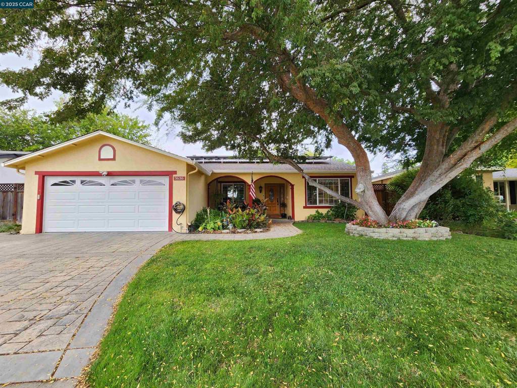 This beautiful and spacious single-story home boasts a resort-style backyard with lush tropical landscaping and NO neighbors behind. Nestled on a large 8,144 lot this 4 bed 2 bath home has a desirable open flexible floor plan. Gorgeous wood floors throughout the majority of the home and durable tile in the kitchen. Natural lighting fills the kitchen & family room through the large picture window & sliding glass door with views to the picturesque backyard. Granite kitchen countertops allow additional seating for a breakfast bar. The cozy family room with brick fireplace opens to the dining room and kitchen, making this a great entertaining space for both casual & formal affairs. The light and bright living room is right off the entry, looking out to the expansive front yard. modern and recessed lighting throughout. 3 good size bedrooms with 1 being used a convenient office. Large primary suite with 2 separate closets. A wide covered front porch that's ideal for relaxing or greeting guests. Paver stone driveway/walkway. Close proximity to sports parks, shopping & eateries. Convenient commute options, close to wonderful Pleasanton schools & business park. Can't you just picture yourself here!!