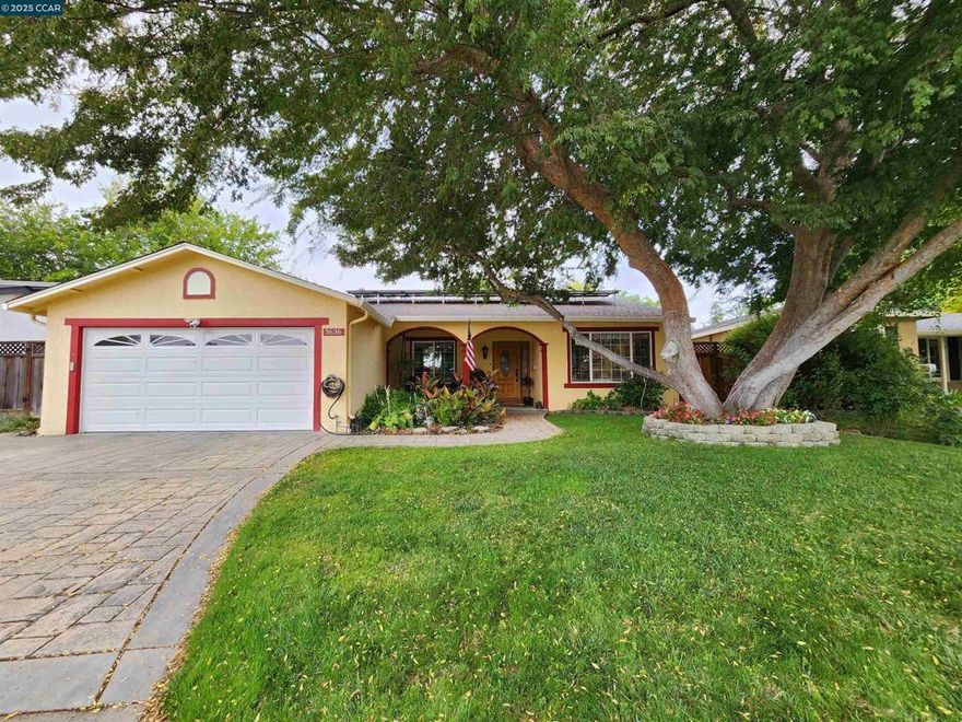 This beautiful and spacious single-story home boasts a resort-style backyard with lush tropical landscaping and NO neighbors behind. Nestled on a large 8,144 lot this 4 bed 2 bath home has a desirable open flexible floor plan. Gorgeous wood floors throughout the majority of the home and durable tile in the kitchen. Natural lighting fills the kitchen & family room through the large picture window & sliding glass door with views to the picturesque backyard. Granite kitchen countertops allow additional seating for a breakfast bar. The cozy family room with brick fireplace opens to the dining room and kitchen, making this a great entertaining space for both casual & formal affairs. The light and bright living room is right off the entry, looking out to the expansive front yard. modern and recessed lighting throughout. 3 good size bedrooms with 1 being used a convenient office. Large primary suite with 2 separate closets. A wide covered front porch that's ideal for relaxing or greeting guests. Paver stone driveway/walkway. Close proximity to sports parks, shopping & eateries. Convenient commute options, close to wonderful Pleasanton schools & business park. Can't you just picture yourself here!!