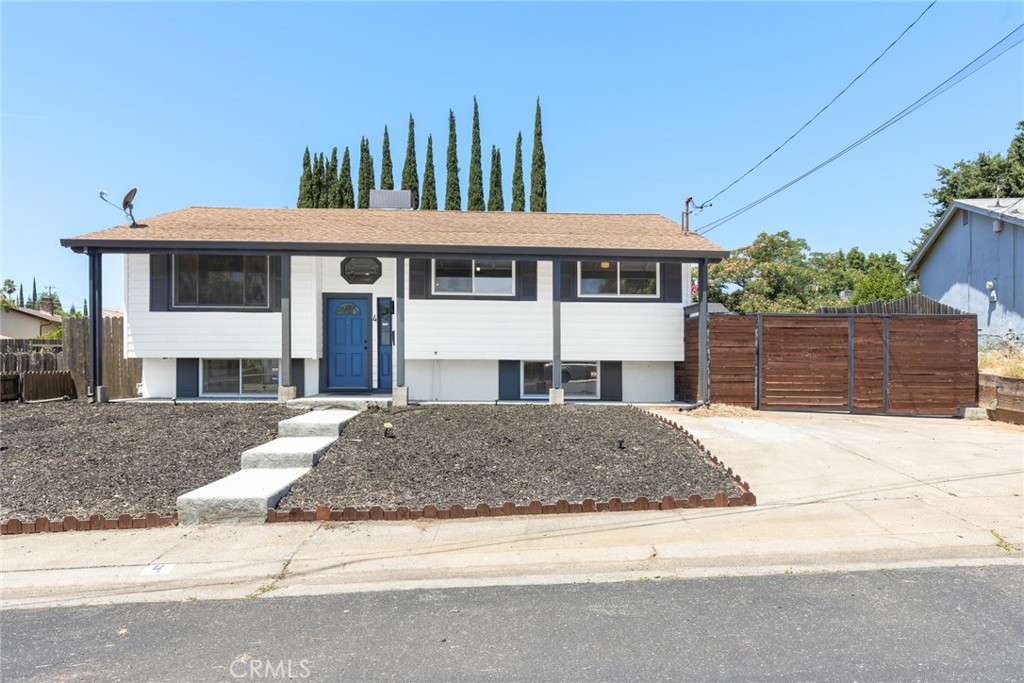 Modern and rustic charm! This beautifully remodeled 4-bedroom, 2-bathroom home is located in a quiet, well-established neighborhood just minutes from downtown and close to schools. The stylish split-level residence perfectly blends modern updates with rustic charm—featuring fresh paint, updated fixtures, and beautiful flooring throughout. Stay cool or cozy year-round central heating and air. Large windows allow for the natural light to flow in seamlessly. The layout is ideal for entertaining or everyday living with 3 bedrooms, a bathroom, and a common area downstairs while the upstairs offers an additional bedroom with an en-suite bathroom in addition to the kitchen, living room, dining area and office. The front yard is conveniently low maintenance with water conservation in mind. In the back yard you'll find privacy, space, a nicely sized deck and a detached garage. The long driveway offers ample parking for a boat or RV. This home is move-in ready and waiting for you!