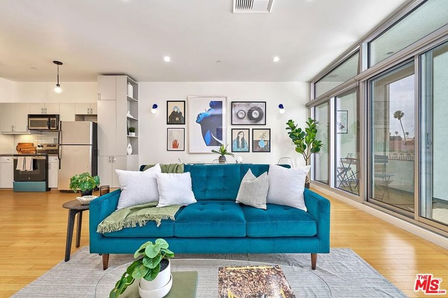 This bright and spacious 1-bedroom unit is located in The Mercury, a well-known high-rise building in the heart of Koreatown. Spacious 1 bed, 1 bath unit with 830 sqft larger than most 1-bedroom units in the same building. The unit offers a generous floor plan with high ceilings and a large, private north-facing extra patio great for outdoor dining or extra space. Inside, you'll find hardwood floors throughout, updated recessed lighting, and a modern kitchen with a brand-new electric stove and oven. The in-unit washer and dryer were recently replaced, adding extra convenience. The bedroom features a walk-in closet and functional layout. The Mercury offers top-tier amenities, including 24-hour security, front desk service, a rooftop infinity pool and spa, a fully equipped gym, and a beautifully landscaped garden with BBQ grills and lounge areas all with stunning city views. Enjoy comfortable living in one of the most walkable and vibrant neighborhoods in Los Angeles.