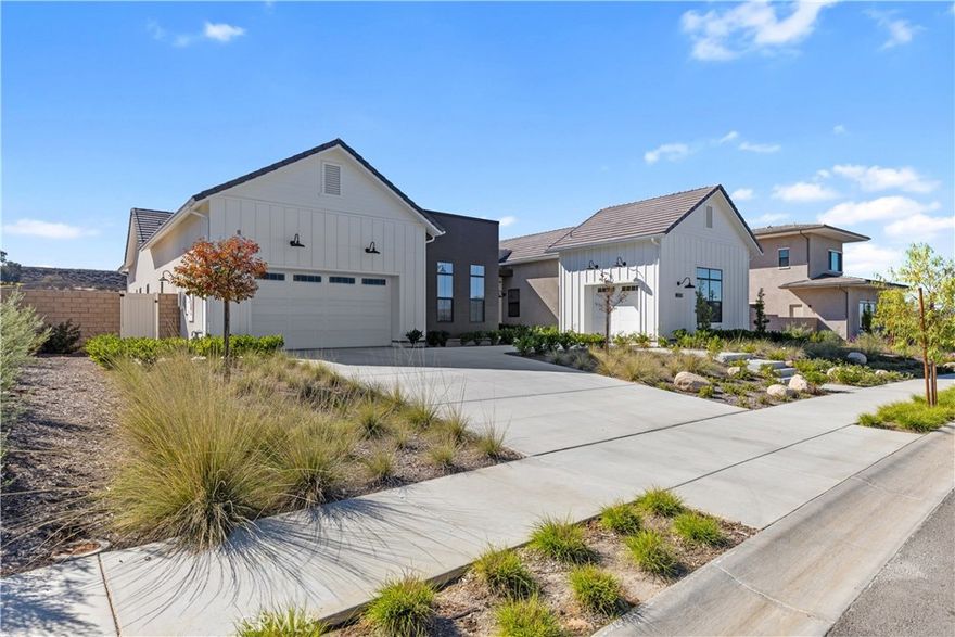 Now available in the exclusive gated enclave of Sommers Bend—one of Temecula’s most desirable wine country communities—this stunning single-story SHAWOOD residence features the sought-after ENSO floor plan, offering 4 bedrooms plus a private-entry casita, 4.5 baths, and 3,601 sq ft of modern luxury on an expansive 23,087 sq ft lot. 

Built by SHAWOOD, the Japanese luxury home brand by Sekisui House, this residence showcases their proprietary precision-engineered post-and-beam framing system, factory-crafted for exceptional strength, energy efficiency, and architectural elegance. Among the most premium homes in Sommers Bend, this one-year-new property highlights soaring ceilings with exposed wood beams, rich wood-trimmed accents, and an open-concept design that flows effortlessly between living spaces. 

The gourmet kitchen is a showstopper—featuring a ridged ceramic backsplash, professional-grade stainless appliances including a 9-burner range with grill, pot filler, dual wall ovens, and an industrial-grade hood—along with a full staging kitchen complete with second refrigerator, sink, and convection oven. A huge walk-in pantry and mudroom provide exceptional function, while two 10-foot electric fireplaces add warmth—one in the great room and another in a retreat within the family wing, ideal for a study, game room, or home school space. The private-entry casita offers its own bath and makes a perfect guest suite or home office. The luxurious primary wing delivers sweeping vineyard and hillside views, a spa-worthy bath with soaking tub, dual-person shower, his-and-her full-size closets, and refined finishes throughout. 

The large lot offers ample room for a future pool, patio, or sport court. Energy-efficient features include paid solar, two Tesla Powerwall batteries, and a finished 3-car garage with epoxy flooring. Residents of Sommers Bend enjoy resort-style amenities including a clubhouse, pool, spa, fitness center, sports park, and scenic trails. With only 57 SHAWOOD homes planned, this ENSO floor plan is a rare opportunity to own one of Temecula’s finest single-story residences in the heart of wine country.