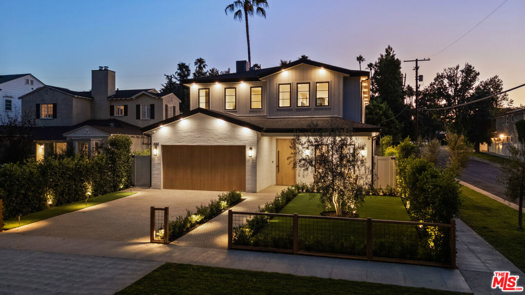 Step into a realm of luxury and sophistication with this exquisite 2025 residence and Guest House nestled in the esteemed Footbridge Square of Studio City. This architectural treasure exemplifies refined elegance and impeccable design, ensconced within one of the city's most picturesque, tree-lined neighborhoods. At first glance, the home's inviting facade seamlessly complements its serene surroundings. Every element of this residence has been thoughtfully curated, ensuring a living experience that is as opulent as it is welcoming. Inside, modern convenience meets timeless comfort with the latest in smart home technology, featuring a Control4 system that effortlessly manages lighting, climate, security, and entertainment. The addition of solar panels underscores the home's commitment to eco-friendly living and energy efficiency. The interior unfolds into an open-concept living space, where thoughtful design and high functionality converge. Large disappearing glass walls blur the line between indoors and outdoors, inviting natural beauty to become part of the everyday experience. The meticulously landscaped grounds are both eco-conscious and visually captivating. The heart of the home lies in its state-of-the-art kitchen, a culinary sanctuary for the passionate chef. Here, lustrous porcelain countertops, a full-size refrigerator and freezer, and professional-grade appliances transform meal preparation into an art form. The luxurious primary suite offers a sanctuary of comfort, while four additional en suite bedrooms provide ample space and privacy for family and guests. Beyond its sumptuous interiors, the residence offers a private backyard oasis, embodying the quintessential California lifestyle of outdoor leisure and entertainment. The property also includes a splendid Guest House/ADU, complete with a living area, kitchen, bedroom, and bath, providing versatile living options. Located within the renowned Carpenter Charter School District and a leisurely stroll from Ventura Blvd's vibrant shopping and dining, this home offers an enviable blend of convenience and prestige. With proximity to major film and TV studios and the beloved Sunday Farmer's Market, this residence encapsulates the very best of Studio City living. Welcome to your new home!