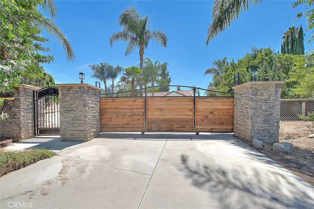 AROUND 200K IN UPGRADES!!!!WOODCREST AREA, LUXURIOUS HORSE PROPERTY CUSTOM BUILT HOME, OPEN FLOOR PLAN!!!!!!3 EXTRA LARGE BEDROOMS SITS ON JUST UNDER AN ACRE, IDEAL TO BUILT AN ADU OR A NICE POOL!!! SEPARATE STRUCTURE THAT CAN BE USE AS A EXTRA 2 CAR GARAGE OR A WORKSHOP!!!!VERY PRIVATE ENTRANCE WITH A LARGE ROUNDABOUT STYLE! DRIVEWAY!!! BEAUTIFUL LANDSCAPING WITH OVER 20 PALM TREES, MATURE TREES ALONG THE PROPERTY ANF FRUIT TREES INCLUDING ORANGE TREES, LEMON AND EVEN A PERSIMON TREE!!! FULLY REMODELED FROM A TO Z!!!! EVERY SINGLE DETAIL WAS METICULOUSLY DONE WITH HIGH QUALITY MATERIAL AND PROFESSIONAL WORK FOR YOUR ENJOYMENT!!! UPGRADES INCLUDE NEW MODERN GATE WITH WITH NEW AUTOMATIC OPENER AND REMOTES!!!!!!! NEW LANDSCAPING!!!! NEW HIGH QUALITY MODERN BLACK WINDOWS AND NEW ENTRY DOOR!!!! NEW INTERIOR DOORS!!!!!FULLY MODERNLY REMODELED BATHROOMS!!!! FULLY UPGRADED KITCHEN WITH MODERN NEW CABINETS QUARTZ COUNTERTOPS AND QUARTZ BACKSPLASH UP TO THE CEILINGS!!!!! NEW BLACK STAINLESS STEEL APPLIANCES, BLACK STAINLESS STEELL HOOD RANGE!!!! EXTRA LARGE PENINSULA WITH BREAKFAST AREA!!!! AMAZING COFFEE BAR NEXT TO THE LARGE PANTRY!!!! NEW EXTERIOR AN INTERIOR PAINT!!!!! NEW LUXURY VINYL PLANK FLOORING THROUGHOUT THE HOUSE!!!!! NEW 6 INCHES HIGH BASEBOARDS!!!! RENOVATED CHIMNEY WITH A MODERN LOOK!!!! NEW AC UNIT!!!! NEW SMART ThERMOSTAT THAT YOU CAN CONTROL WITH YOUR PHONE!!!!!UPGRADED WET BAR!!!! NEW LIGHTS FIXTURES INSIDE AND OUT !!!!!! NEW CEILING FANS WITH REMOTE CONTROLS!!!NEW WATER HEATHER!!!! UPGRADED INSIDE LAUNDRY-ROOM WITH NEW CABINETS AND NEW WASHER AND DRYER HOOKUPS!!!!TO MUCH TO SAY!!! SHOW IT AND SELL IT!!!!! VERY LOW TAX!!!!!!!
