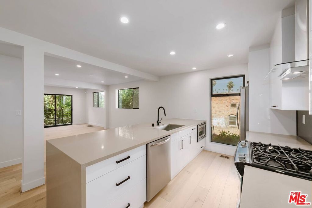 Welcome to your dream home in the heart of Silver Lake! This stunning 2-bedroom, 2.5-bathroom bottom unit offers an abundance of modern amenities and breathtaking views. With engineered European Oak flooring and recessed lighting throughout, this home provides a perfect blend of style and comfort.This stunning fully remodeled unit features brand new Engineered European Oak flooring and recessed lighting throughout the unit. Open living room and kitchen with a full set of brand new stainless steel appliances, a wine cooler and rolled steel backsplash. Clerestory windows flood the home with natural light. Step outside onto your own private patio, where you can unwind, entertain, or simply soak in the fresh air and sunshine overlooking the Silver Lake Hills and city below. Stay cool and comfortable year-round with central air conditioning, a luxury that's especially appreciated during warmer months. Washer and dryer inside the unit for your convenience. This property is located in Silver Lake. Minutes away from the Sunset Junction shops and restaurants and the famous Dodger Stadium. Conveniently located near the 101 and 110 freeway. Nearby neighborhoods include Hollywood, Echo Park, Downtown Los Angeles, Koreatown and Glendale.
