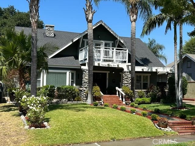 The moment you step foot in this elegant Craftsman Style Bungalow, charm and appeal beckon you down the brick-ribbon walkway with its delightful landscaping and swaggering palms. Enjoy passersby from the covered porch with stone accents and ample sitting area. Once you step inside this renovated classic circa 1909 your are transported to a bygone era with box beam ceilings, picture rail, dark chocolate wood floors, beefy crown molding and baseboards; yet modern amenities flourish! The bathrooms have been updated with stylish use of tile & granite; classic fixtures and hardware.
The backyard includes a dreamy entertainer's backyard, a pristine pool with a recently upgraded pebble surface. Privacy and exclusivity await you in this lush and private oasis. Step inside to discover a recently updated galley kitchen with new cabinets, open shelving and quartz countertops. A 2 car garage with ADU potential.