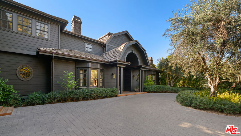 Stunning estate located in an ultra exclusive gated enclave. Situated behind gates on 1.85 acres overlooking incredible canyon and ocean views. The home was completely remodeled by Tommy & Kathy Clements who implemented a perfect blend of natural and warm organic materials, reclaimed woods and rare marbles/stone throughout. There's a beautiful 2 story entry with large living room, spectacular family room, gourmet kitchen with eat-in breakfast room, formal dining, office/library. Upstairs primary suite with sitting room and fireplace with separate dressing areas/walk-in closets and spectacular bath. Separate gym and world class theatre. Sprawling grounds include a huge grassy lawn, large swimmers pool, cabana & bbq.