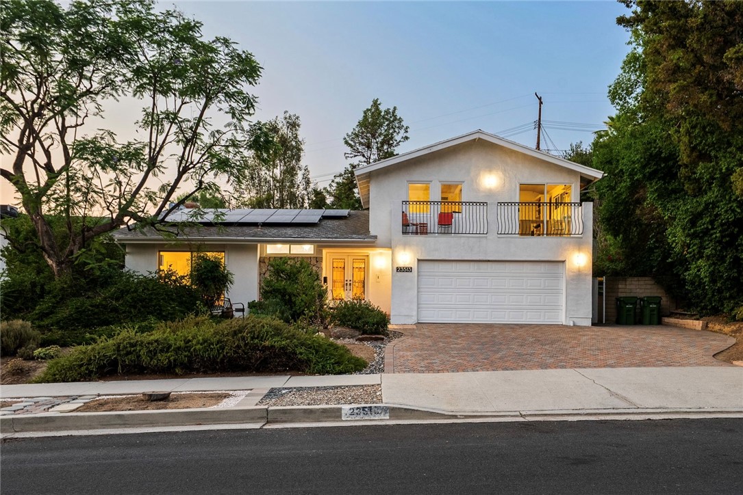 Zoned to top-rated schools including Justice Street Academy Charter and the award-winning El Camino Real Charter High School, this well-loved Heltzer-built pool home sits on a spacious 11,000+ sq ft lot in one of West Hills’ most desirable neighborhoods. With 2,090 sq ft of living space, this 4 bed, 2 bath home is filled with natural light, tree-top and mountain views, and a functional layout perfect for everyday living and entertaining. The living and dining areas flow seamlessly to the backyard, offering a true indoor-outdoor lifestyle. The kitchen is full of potential and ready for your custom design, with space to create a modern culinary hub tailored to your needs. The first-floor primary suite features sliding glass doors to the garden, an ensuite bath with walk-in shower, and generous closet space. Upstairs are three additional bedrooms with one bedroom offering a private terrace to enjoy sunrises and mountain views. The second full bath includes dual sinks and a tub/shower combo. A spacious indoor laundry room adds convenience with extra storage and space for a future mudroom. The backyard is a true highlight with a sparkling pool, patio, and yard areas for gardening, entertaining and relaxing in the Los Angeles sun. There is also room to expand the home or build a second dwelling, as many neighbors have done, offering exciting potential to customize your dream estate. Additional features include parking for up to 5 cars, potential RV access, a wide driveway, and a 2-car garage. Located minutes from scenic hiking trails, luxury retail centers Westfield Topanga, The Village, and Calabasas Commons, this property blends character, space, and future opportunity in an unbeatable West Hills location.