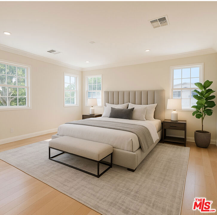 Welcome to this beautifully lit and expansive 5-bedroom home, perfectly situated in one of Beverly Hills' most desirable neighborhoods. Just steps from shops, restaurants, and houses of worship, this home offers both convenience and comfort in a walkable, vibrant community. Inside, you'll find a bright and welcoming two-story entry. The inviting living room showcases large picture windows with charming street views and flows seamlessly into the dining area, kitchen, and cozy breakfast nook. The upper level features three bedrooms and two bathrooms, while the main level includes two additional bedrooms and a full bath ideal for families or guests. A conveniently located laundry room is just off the kitchen. Outside, the generous backyard is perfect for entertaining and relaxation, featuring a lush garden with fruit trees, a converted garage, and a versatile gym or flex space. This is a must-see property offering space, light, and location all in one!