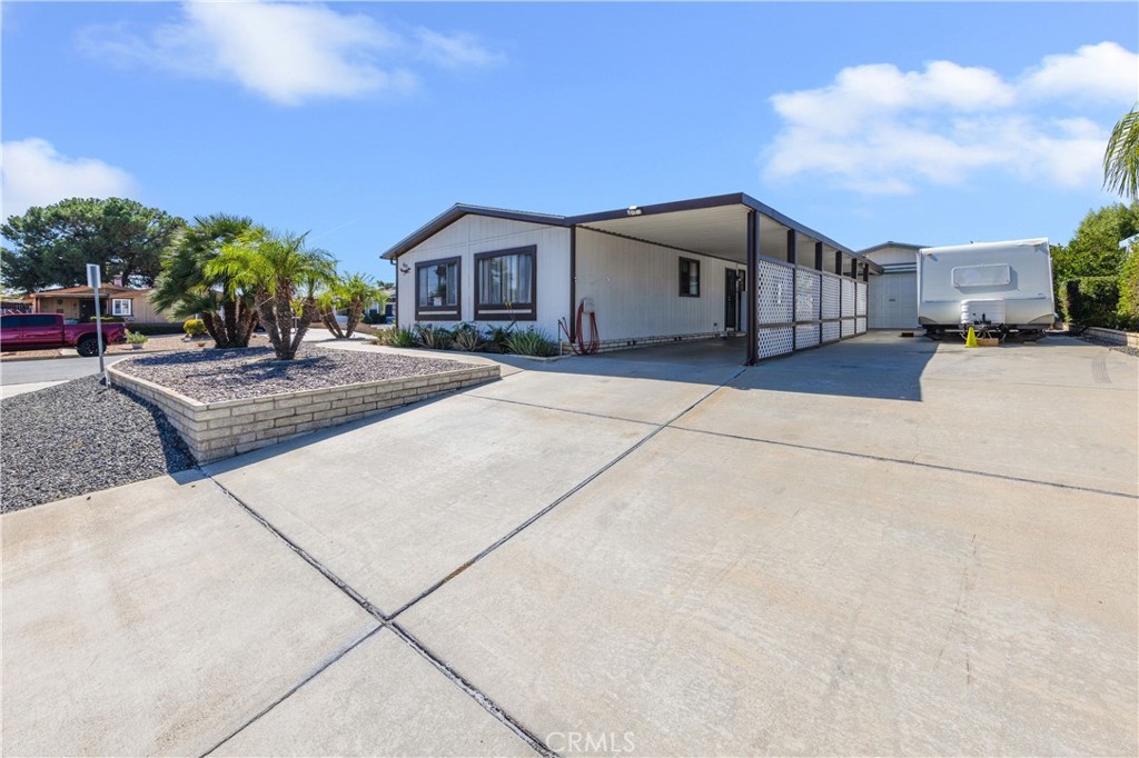 Lovely super clean, turnkey, 2 bedroom- 2-bathroom manufacture home, proudly equipped with solar power. Step inside to discover 1,344 sq ft of comfortable living space thoughtfully laid out for modern living. This home offers low maintenance front and back yar, central A/C and furnace, is set on a permanent foundation, ensuring stability and peace of mind. No HOA means no restrictive rules and no HOA fees, a driveway with RV parking and a convenient dump station and electrical hook-up. The two-car detached garage, and a separated covered carport offer even more parking options. Relax and unwind on the covered front patio, perfect for enjoying your morning coffee or greeting neighbors passing by. Nestled on its own 6534 sq ft lot
Come and see this SUPER CLEAN, TURNKEY home, you won't be disappointed. Don't miss this exceptional opportunity to own this home.