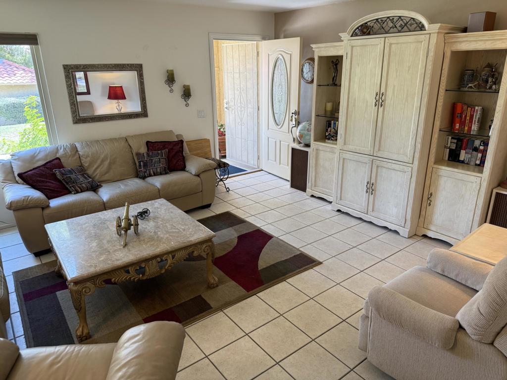 Here's a very well located townhouse condo in a very social and recreational community. This condo has had some very good improvements, especially in the fully remodeled kitchen with upgraded cabinets and granite countertops. Dual pane windows, tile flooring downstairs and carpeting upstairs in the two bedrooms with convenient ensuite baths. The location in Deep Canyon Tennis Club is just about ideal. It is close to the tennis pro shop where fresh coffee is brewing and friends are gathering for conversation every morning during the season. Also close by is the Clubhouse newly rebuilt just 3 years ago as well as the expanded and nicely equipped workout room that is very near the main lap pool. Around the property there are a total of 12 pools with 4 hot tubes. Tennis is hugely active on 12 courts and Pickleball is rocking on a six court facility. There is also an active Bocce court as well as a golf putting green and chipping practice area. So much happens here in terms of activity like Bridge, water aerobics, yoga, book club, quilting and much more. This goes along with a very active tennis social and tournament schedule with team play in-house and in competition with other communities. And, the same is happening at Pickleball. And there is a full contingent of parties, cookouts, celebrations as well as frequent musical entertainment. Come check it out. You will be glad you did, we think.