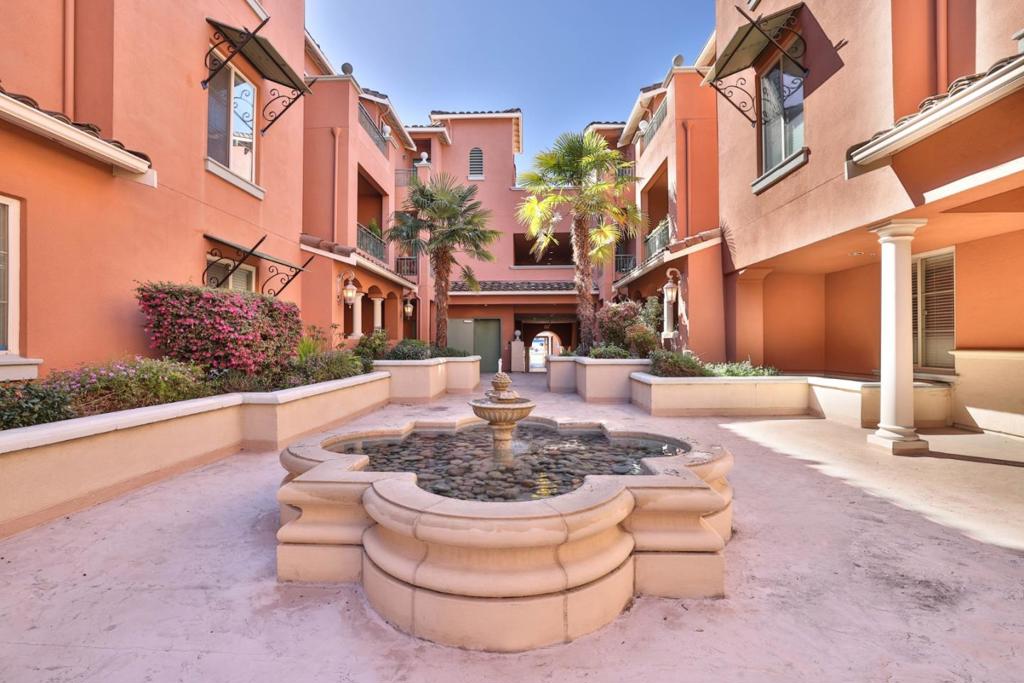 Welcome to this spacious home nestled in the heart of Cupertino. This beautiful unit has the best location in the complex and is on the top floor of a corner penthouse with a balcony view of the mountains. Conveniently located close to Apple offices, tasty restaurants, shopping, and highly rated Cupertino Schools. The home boasts an open floor plan that is light and bright. Living room with an open dining area. The kitchen features gas cooktop, granite counters, rich wood cabinetry, and a breakfast bar. The primary bedroom has a spacious walk-in closet and updated bathroom. Relax by the fireplace on cool evenings or enjoy the private balcony. In-unit laundry with washer and dryer included. The bathrooms are elegantly designed with granite countertops and a combination of shower and tub. Central air conditioning and heating ensure year-round comfort. This property also includes an underground secured parking garage, private storage locker and bike storage, and the parking space just a few steps from the elevator. aDDITIONAL GUEST PARKING IN BACK LOT.