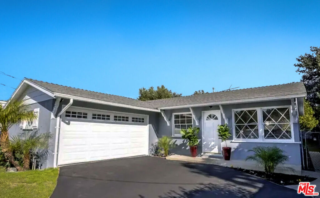 Charming single-story home nestled on a quiet, tree-lined street in the heart of Chatsworth. This 3-bedroom, 2-bath residence offers 1,164 square feet of comfortable living space and is move-in ready. Step onto the welcoming front porch and into a bright, open floor plan filled with natural light. The kitchen features ample custom cabinetry and opens to the dining area, with direct access to a private backyard through a new exterior door. The primary suite includes an updated bathroom with a dual-sink vanity and a stylish tile shower. Recent improvements include fresh interior and exterior paint, a new front door, new laminate and carpet flooring, smooth ceilings, recessed lighting, and updated ceiling fans.The spacious backyard offers grassy areas and several fruit trees, with room to personalize your outdoor oasis plus you can add ADU in the back lot, ideal for guests, rental income, or a home office. Additional highlights include a newly paved driveway, lush landscaping, a 2-car attached garage, and extra parking space. Located close to shopping, dining, hiking trails, and easy access to the 118 freeway. A wonderful opportunity to own a beautiful home with bonus space in a desirable Chatsworth neighborhood. Welcome home!