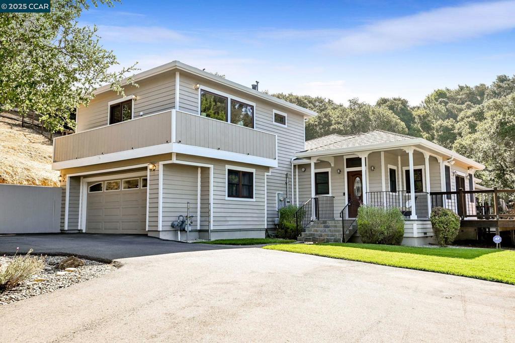 Modern Elegance Meets Peaceful Seclusion in the Hayward Hills! Nestled on a private 3.24-acre lot and surrounded by majestic Oak Trees and Bay views, this beautifully designed home offers the privacy and tranquility you’ve been looking for. Built in 2018, this newer home features an open floor plan filled with natural light, which streams through Andersen windows and doors. The gourmet kitchen is a chef’s delight, equipped with premium Bosch appliances, a 5-burner gas stove, convection double oven, toe-kick lighting, a spacious center island with a second sink, and a built-in wine fridge. Enjoy two luxurious primary suites, one on each level, allowing flexible living arrangements. The upstairs suite boasts stunning Bay views, making every morning feel like a getaway. Step outside onto the newly refinished deck, perfect for family BBQ's, morning coffee, or unwinding under the stars. A Hot Spring spa offers the ultimate relaxation after a long day. Additional features include a Sprinkler System, Generac generator, Sonos sound system, two LG flat-screen TVs, a Tankless water heater, 60 amp EV charging outlet, 200 Amp electrical service, an advanced septic system, Weather Station, RH Shelving, and a quiet location down a private lane with no through traffic. Don't miss this one!