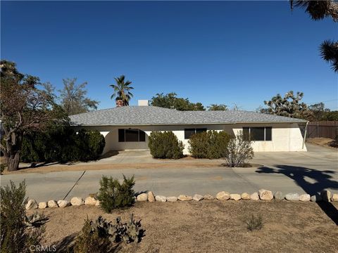 Photo of 58390 Delano Trl, Yucca Valley, CA 92284 (MLS # JT25256434)