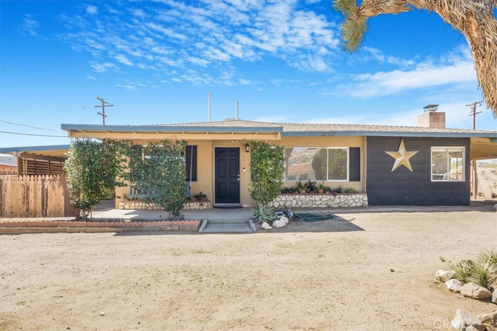 Charming 2-bedroom home with a bonus room, spacious living area, and many upgrades including new flooring, a remodeled bathroom, and freshly painted kitchen with wood countertops. Enjoy year-round comfort with 4 AC/heat split units and savings from paid solar and also a NEM2 Interconnection agreement that is transferable. The large and well-kept 13,000 sq. ft lot with a new fence to give you privacy, offers plenty of space for RV parking, toys, and outdoor living. Features include two driveways, a carport, and a huge 2-car garage with ADU potential. Conveniently located near shops and more. it also comes with a high-end soft water system. Extensive 220V wiring, including RV and EV circuits.